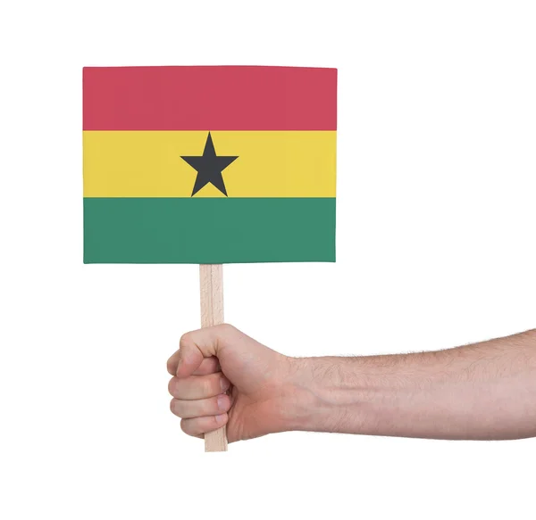 Hand met kleine kaartje - vlag van Ghana — Stockfoto