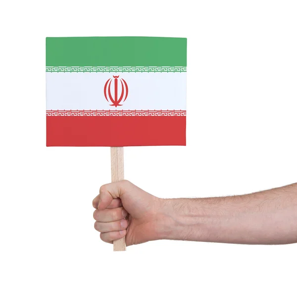 Hand met kleine kaartje - vlag van Iran — Stockfoto