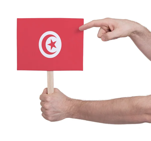 Рука держит маленькую карту - Флаг Туниса — стоковое фото