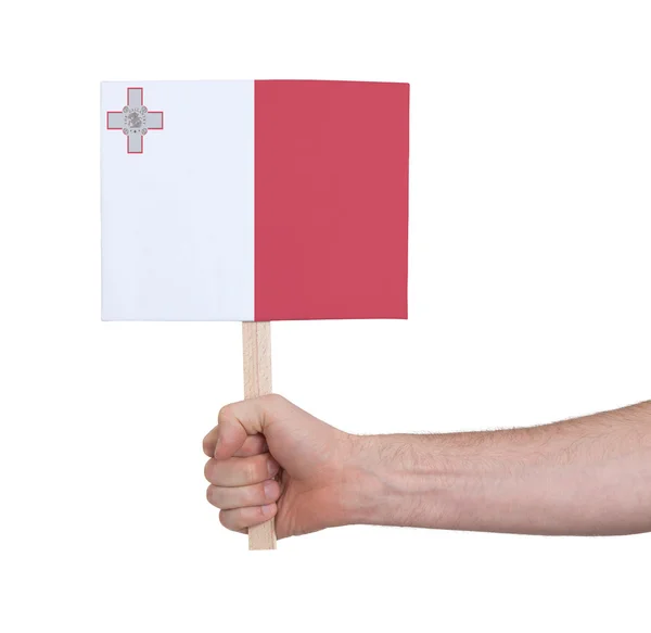 Hand hält kleine Karte - Flagge von Malta — Stockfoto