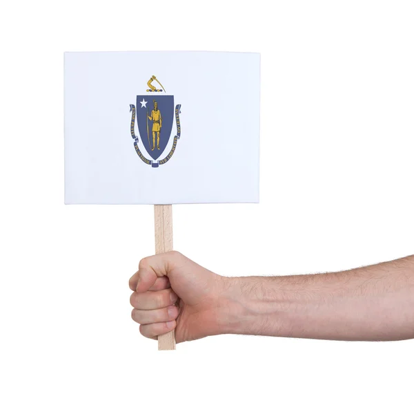 Hand holding small card - Flag of Massachusetts — Stock Photo, Image