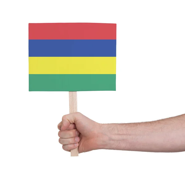 Hand met kleine kaartje - vlag van Mauritius — Stockfoto