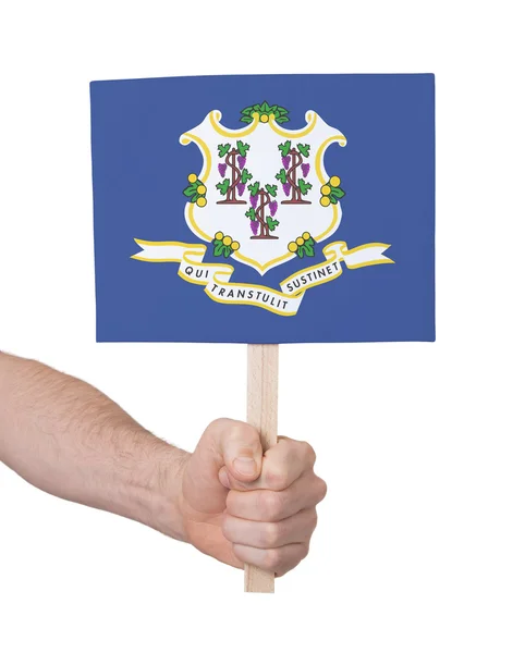 Hand met kleine kaartje - vlag van Connecticut — Stockfoto