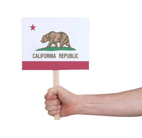 Mano che tiene piccola carta - Bandiera della California — Foto Stock