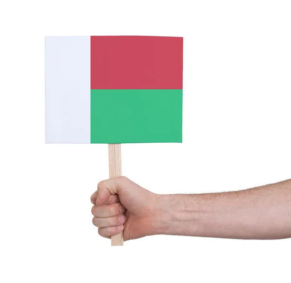 Hand holding small card - Flag of Madagascar — Stock Photo, Image