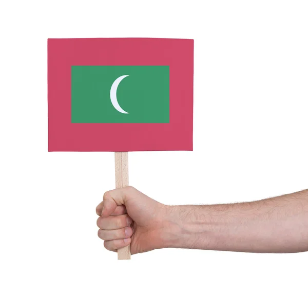 Hand met kleine kaartje - vlag van de Maldiven — Stockfoto