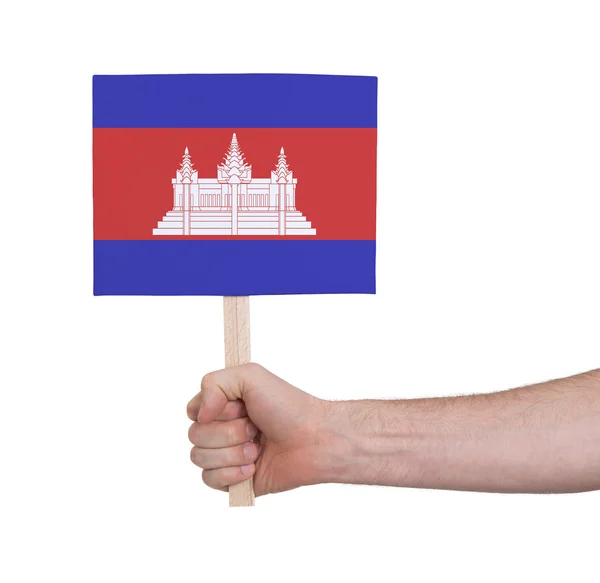 Mano sosteniendo una tarjeta pequeña - Bandera de Camboya —  Fotos de Stock