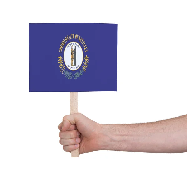 Mão segurando cartão pequeno - Bandeira de Kentucky — Fotografia de Stock
