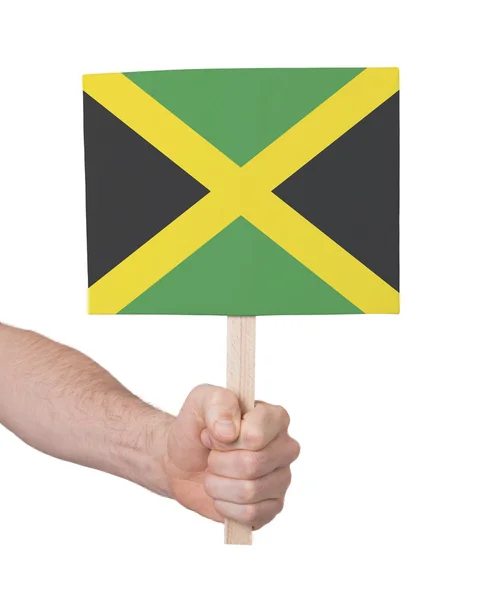 Hand holding small card - Flag of Jamaica — Stock Photo, Image