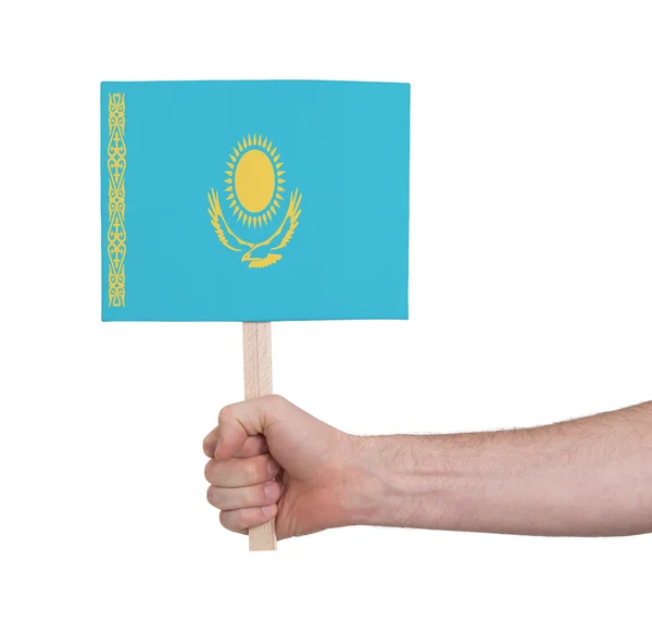Mano che tiene la piccola carta - Bandiera del Kazakistan — Foto Stock
