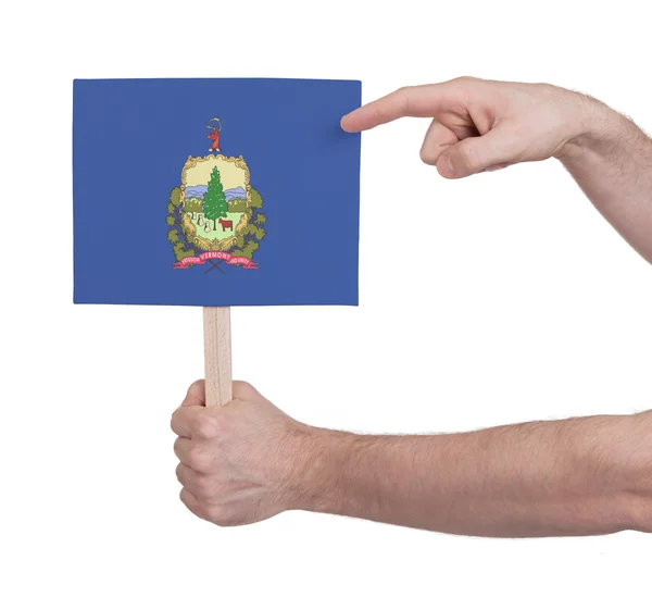 Mano sosteniendo una tarjeta pequeña - Bandera de Vermont —  Fotos de Stock