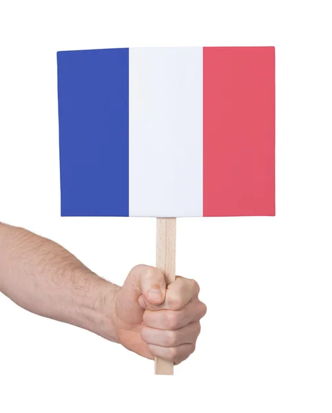 Mano con tarjeta pequeña - Bandera de Francia — Foto de Stock