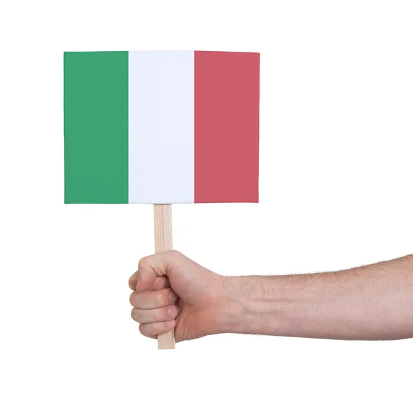 Mão segurando cartão pequeno - Bandeira da Itália — Fotografia de Stock