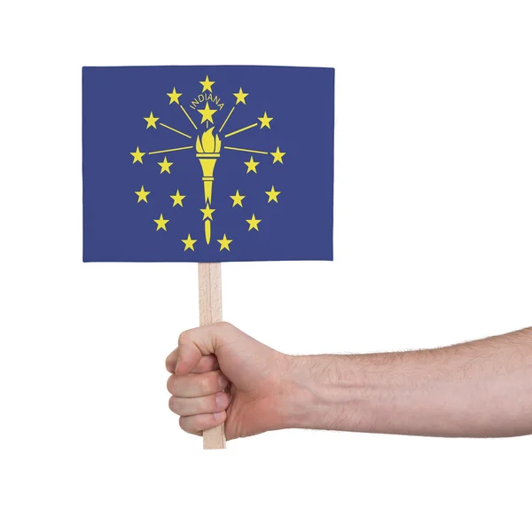 Hand met kleine kaartje - vlag van Indiana — Stockfoto