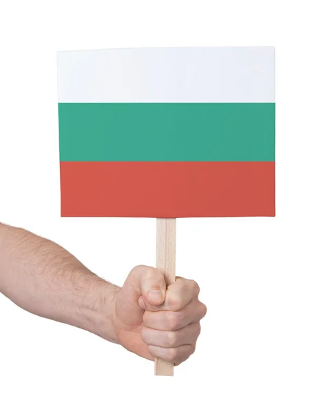 Hand met kleine kaartje - vlag van Bulgarije — Stockfoto