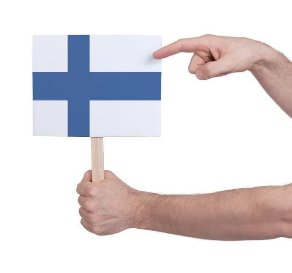 Hand hält kleine Karte - Flagge Finnlands — Stockfoto