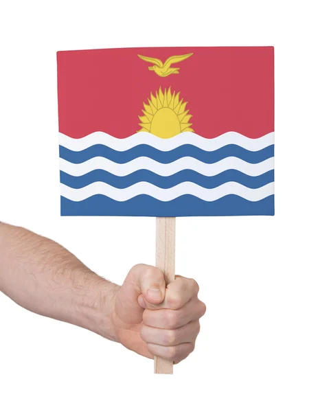 Hand som håller litet kort - flagga Kiribati — Stockfoto