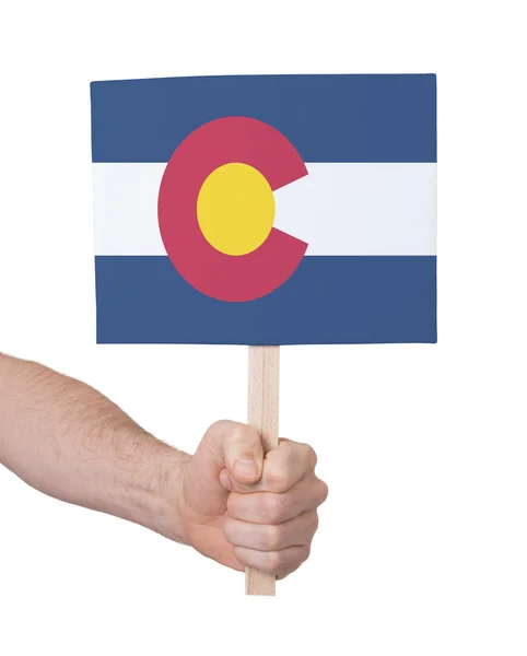 Main tenant une petite carte - Drapeau du Colorado — Photo