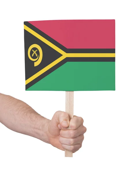 Mão segurando cartão pequeno - Bandeira de Vanuatu — Fotografia de Stock