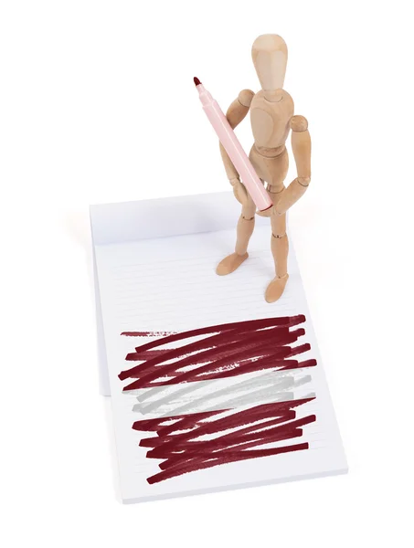 Wooden mannequin made a drawing - Latvia Stock Photo