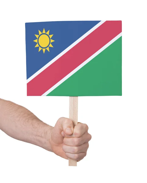 Hand holding small card - Flag of Namibia — Stock Photo, Image