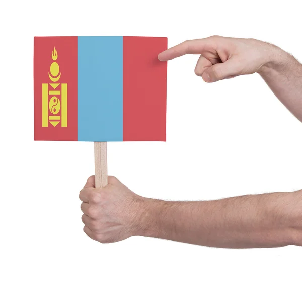 Hand met kleine kaartje - vlag van Mongolië — Stockfoto