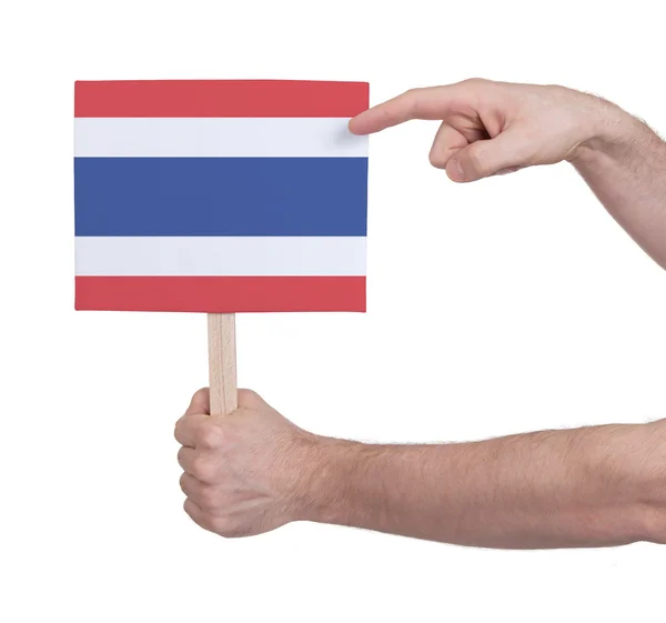 Hand hält kleine Karte - Fahne von Thailand — Stockfoto