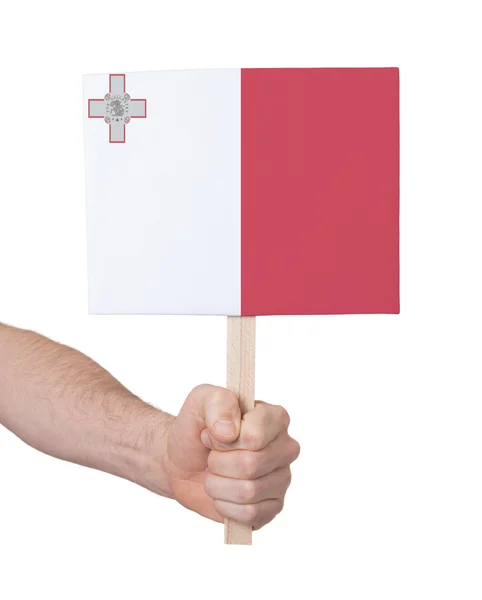 Hand met kleine kaartje - vlag van Malta — Stockfoto