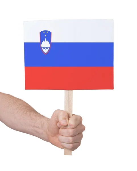 Hand met kleine kaartje - vlag van Slovenië — Stockfoto