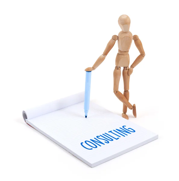 Wooden mannequin writing - Consulting — Stock Photo, Image