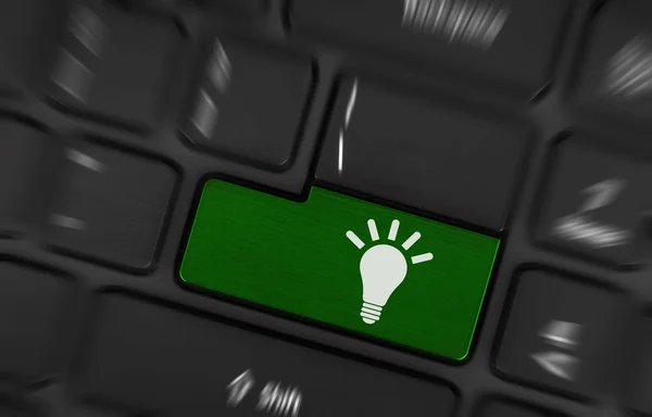 Laptop keyboard with light bulb symbol — Stock Photo, Image
