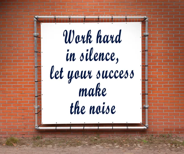 Large banner with inspirational quote on a brick wall — Stock Photo, Image