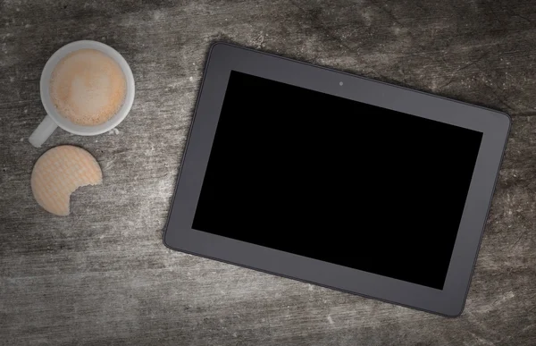 Tablet touch computer gadget on wooden table — Stock Photo, Image