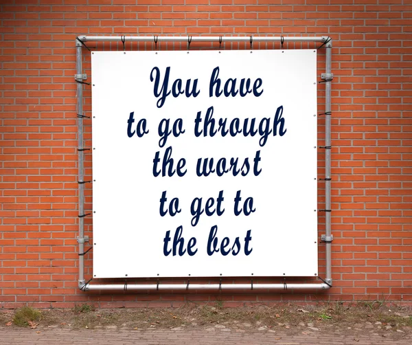 Large banner with inspirational quote on a brick wall — Stock Photo, Image