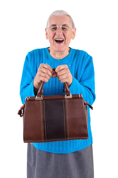 Старшая женщина держит сумку — стоковое фото