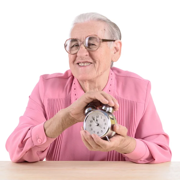 Old woman with clock — Stock Photo, Image