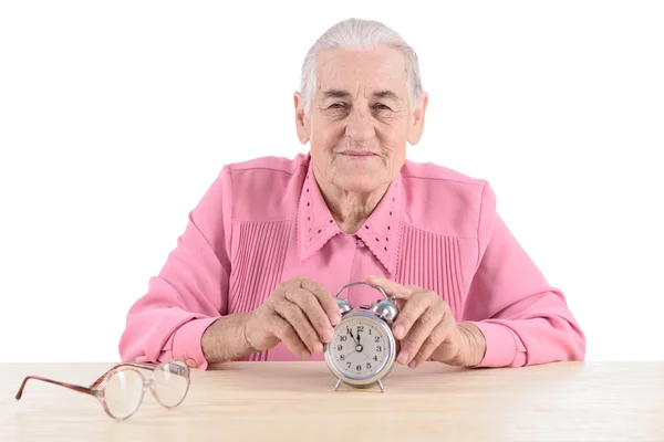 Old woman with clock — Stock Photo, Image