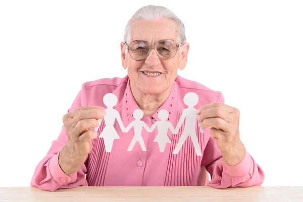 Anciana sosteniendo papel familia —  Fotos de Stock