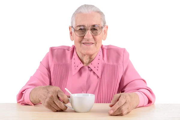 Mulher velha e xícara de chá — Fotografia de Stock