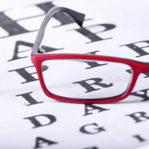 Eyeglasses and eye chart — Stock Photo, Image