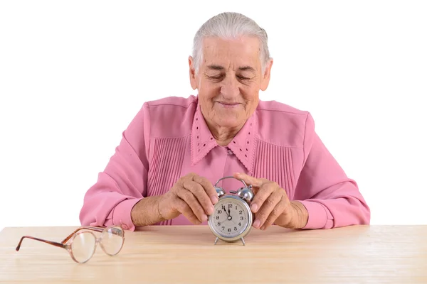 Old woman with clock — Stock Photo, Image