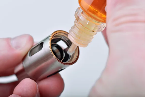 Filling of clearomizer Stock Image