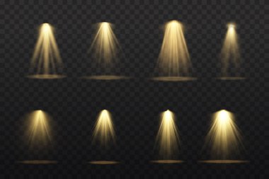 Sahnede sarı spot ışıkları parlıyor.