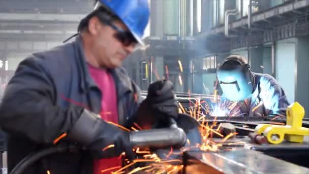 Steel workers and grinding wheel — Stock Video