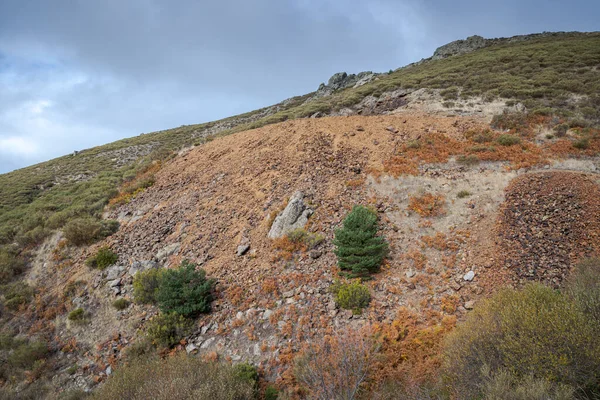 Slag heap in the old silver mine of Bustarviejo, province of Madrid, Spain. The mine was active from the 17th to the 20th century