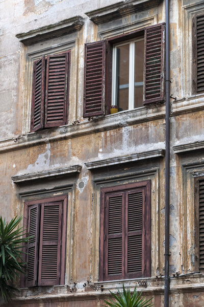 Old windows of a house in Trastevere, Rome, Italy