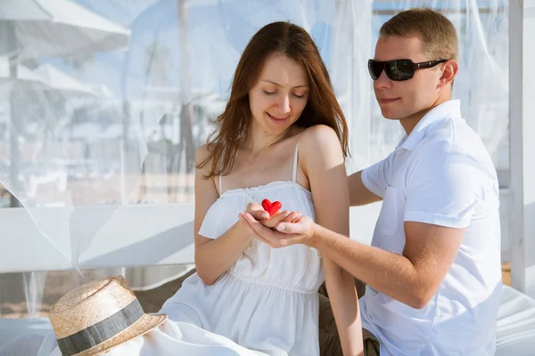 Man and woman holding red heart — Stock Photo, Image