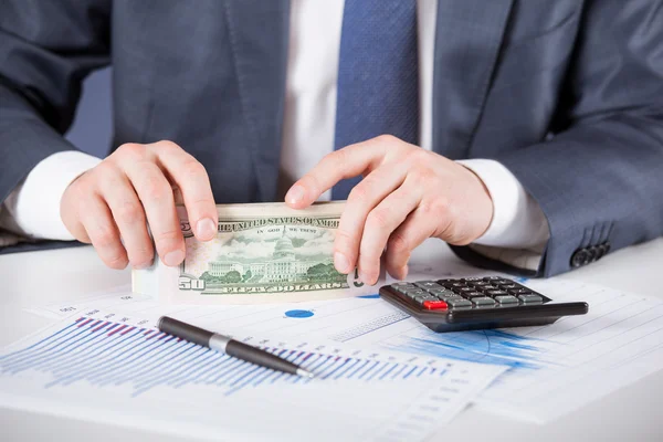 Businessman counting money — Stock Photo, Image