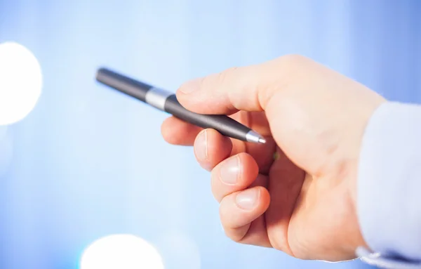 Businessman's hand holding a pen — Stock Photo, Image