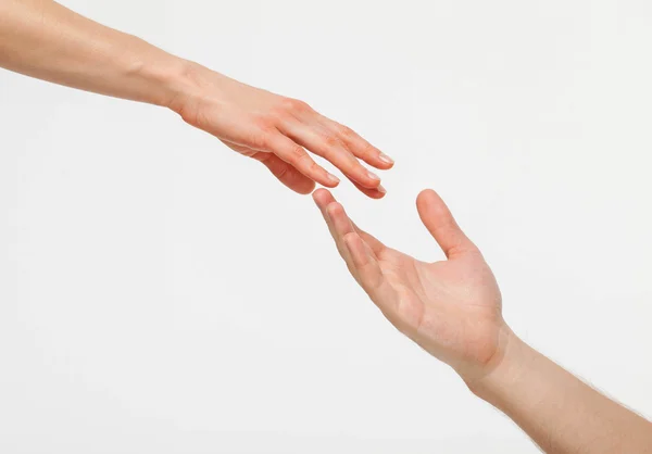 Hands of man and woman reaching out to each other — Stock Photo, Image